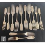 A set of six hallmarked silver fiddle pattern table and dessert forks, each with engraved initial to
