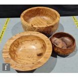 Three contemporary treen bowls by Peter Crook, wood turner, the first a footed example with ribbed