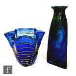A contemporary art glass vase of triangular form with circular neck, cased in mottled green and
