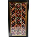 A Turkish kilim ikat woven wool fabric of geometrical design with central vertical band of five
