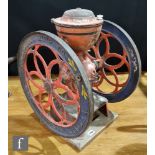 A 19th American double fly wheel coffee grinder by Enterprise MFG Philadelphia, cast iron hopper,