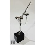 A later 20th Century stylised sculpture of a dancer with leg raised and arms outstretched, in a