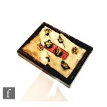A set of early 20th Century Japanese dress studs, the eight fan and square shaped studs with