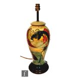 A Moorcroft Pottery table lamp decorated in the Carp pattern designed by Sally Tuffin, marks