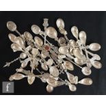 A collection of early to mid 20th Century Dutch silver spoons, mostly souvenir spoons with enamelled