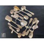 A collection of assorted Georgian and later silver caddy and salt spoons, most by James Beebe,