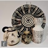 Four pieces of 20th Century monochrome studio pottery comprising a large slip trailed charger with