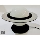 A table lamp in the Art Deco style, formed as Saturn, with an opaque glass shade surrounded by a