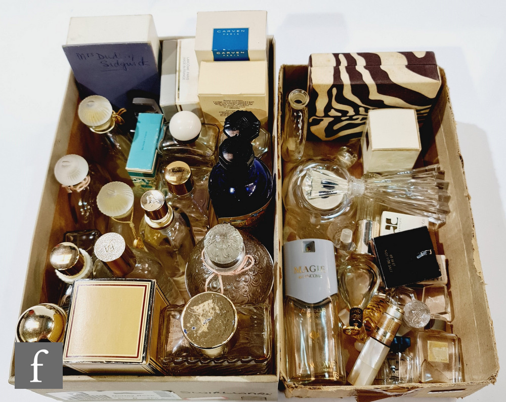 An extensive collection of post 1970s perfume and glass cologne bottles and stoppers, some in