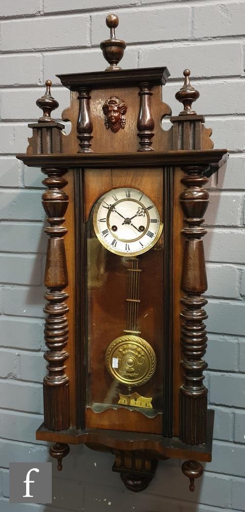 A late 19th Century walnut and stained beechwood regulator wall clock with spring driven movement