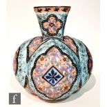 A late 19th Century Bohemian glass vase of quatrelobed form with a flared collar neck with square