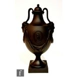A later 20th Century Wedgwood black basalt Heritage Collection Shape No.1 vase and cover, after an