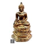 A gilt-bronze figure of Buddha Vajrasana, Tibetan or Nepalese, 18th/19th Century, wearing the