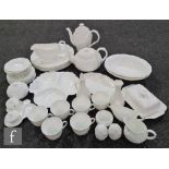 A large collection of Wedgwood Countryware dinner and tea wares comprising a coffee pot, a teapot,