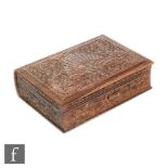 An early 20th Century Indian carved hardwood work box, the interior fitted with a tray enclosed with
