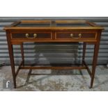 An Edwardian mahogany two drawer bijouterie table later converted from a side table, the glazed