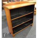 A 19th Century late Regency period rosewood veneered open fronted bookcase with brass line inlaid