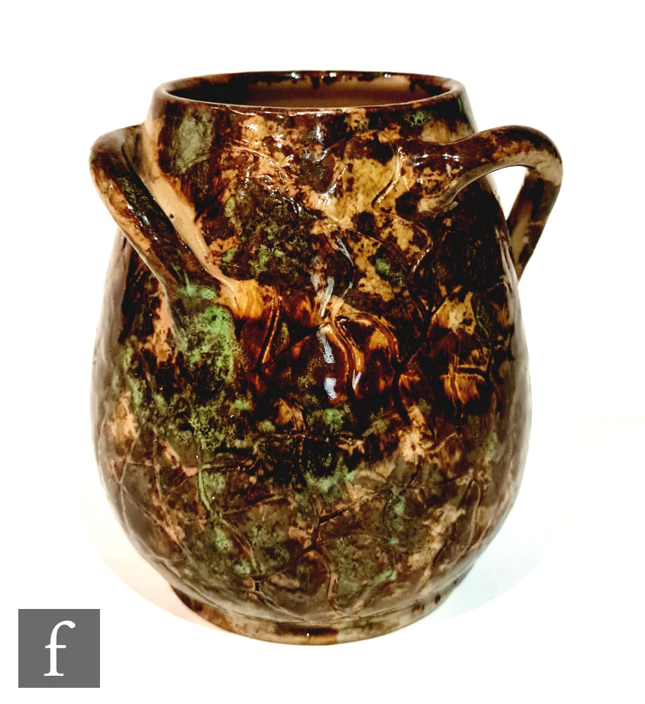 An early 20th Century Fulham Pottery Hurlingham vase of swollen barrel form with three wrythen