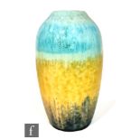 A Ruskin Pottery crystalline vase of swollen form decorated in blue to dark yellow to dark blue with