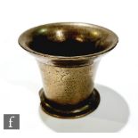 A 17th Century bronze mortar, with everted rim and spreading foot, 11.5cm x height 9cm.