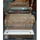 A brass National cash register with back plate 'Amount Purchased' No 357, serial no 1309262W,