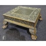 An early 20th Century Anglo Indian brass clad occasional table or stand of square form, detailed