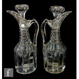 A pair of 19th Century claret decanters, of fluted shouldered form with pillar cut body, prism cut