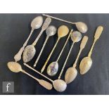 A collection of assorted Russian silver spoons to include examples for lemon tea with niello