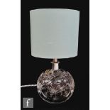A Webb Corbett clear crystal lamp in pattern no. 753, of globe form cut with stylised flowers and