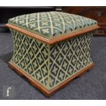 A 19th Century footstool of waisted square form, with a hinged lid and exposed rosewood trim, raised