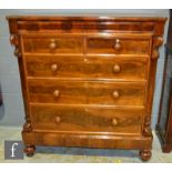A Victorian mahogany chest of two short and three long drawers below a long cushion shaped drawer,