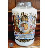 A 19th century pharmaceutical apothecary glass drug jar transfer printed with the armorial Monarch