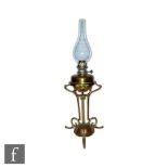 An Edwardian Arts and Crafts style anodized copper table oil lamp by Hinks in the manner of W.A.S.