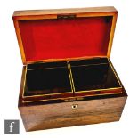 A 19th Century rosewood rectangular tea caddy with brass handle to hinged lid, opening to twin