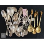 A collection of Victorian and later silver spoons, to include a Spielkartenfest enamel example, a