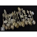 A collection of Victorian silver commemorative teaspoons each with assorted finials, including