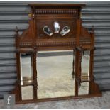 A late Victorian carved mahogany overmantle mirror, turned upright supports, height 100cm x depth