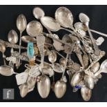 A parcel lot of American and continental silver and white metal teaspoons to include Rolex and New