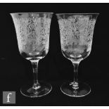 A pair of contemporary Stuart Crystal wine glasses for Holland & Holland, the cup bowl with flared