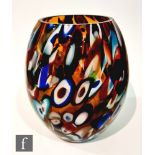 A contemporary art glass vase of swollen ovoid form, internally decorated with multicoloured canes