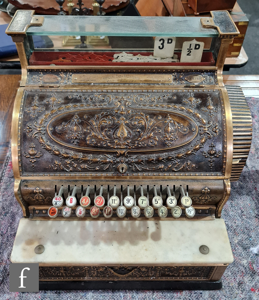 A brass National cash register No S 43 1/4 H, serial no P82406, white marble shelf on ebonised
