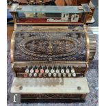 A brass National cash register No S 43 1/4 H, serial no P82406, white marble shelf on ebonised