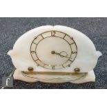 A 1940s Smiths alabaster mantle clock of cloud design on a plinth base, width 27cm.