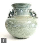 A Chinese celadon Longquan style baluster vase, Qing Dynasty (1644-1912), raised from an unglazed
