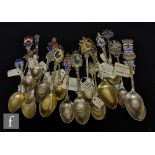 A collection of Victorian and later silver and enamelled commemorative teaspoons some with