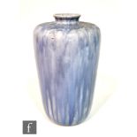 A Ruskin Pottery souffle glazed vase of high shouldered form, decorated in a streaked and mottled