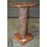 A late 20th Century grey and brown marble pedestal, the square top over plain cylindrical column and
