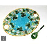 A late 19th Century George Jones & Sons Majolica strawberry dish of oval section, relief moulded