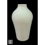 A South Staffordshire white glass vase of baluster form, height 15.5cm.