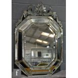 A 20th Century Venetian style wall mirror, with acanthus pediment over bevel cut border panels, laid